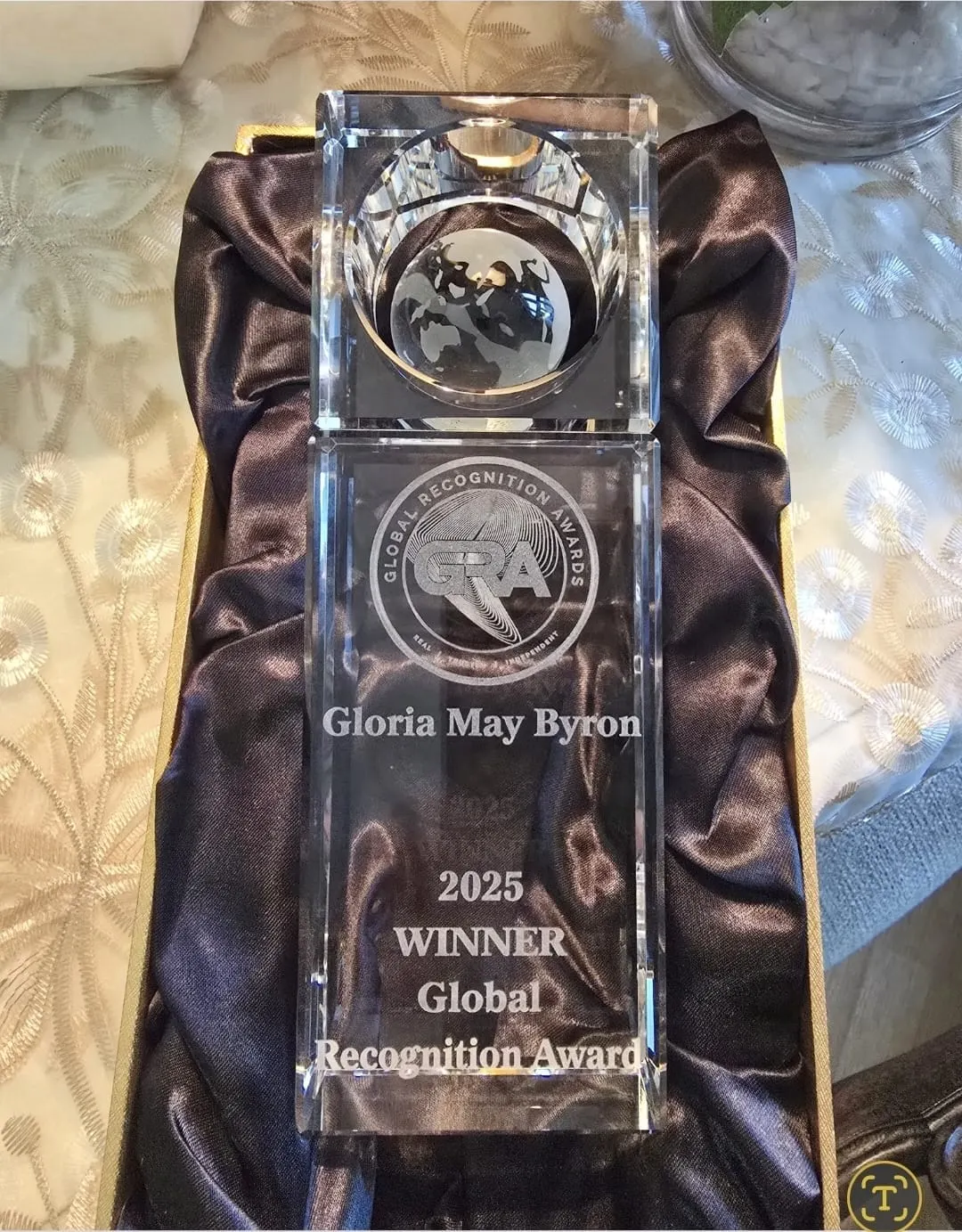 The Global Recognition Awards crystal trophy